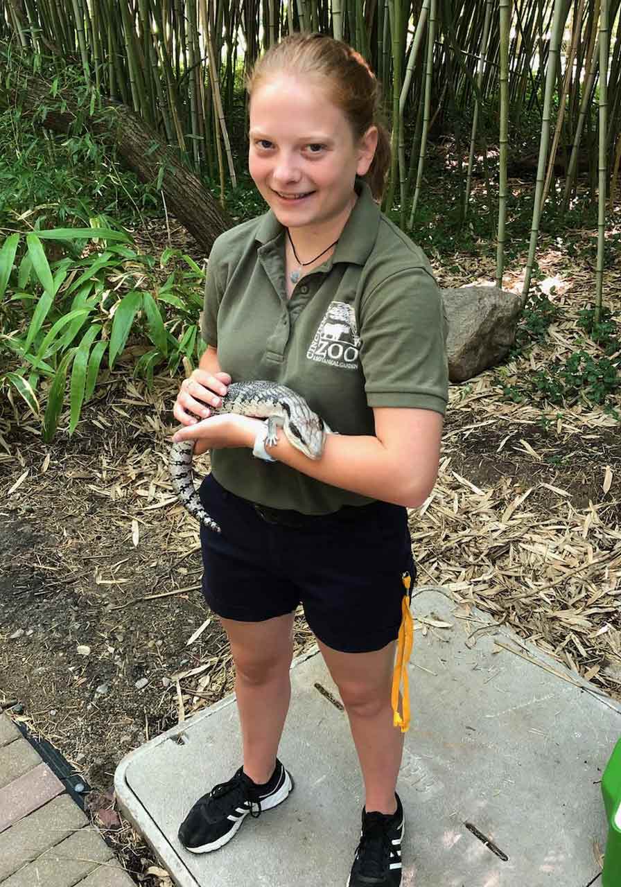 Kristina handling an animal from the education collection